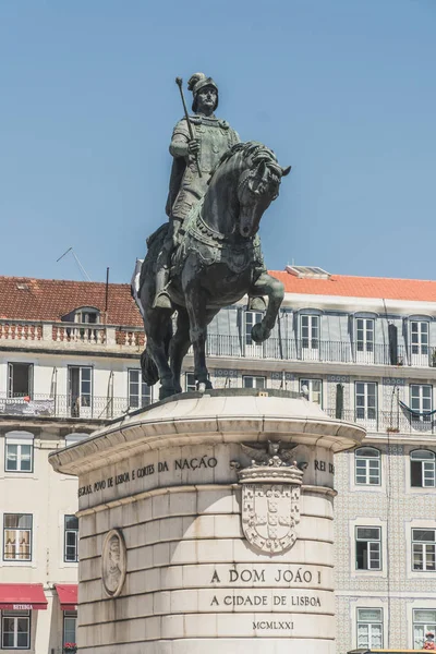 Monument in honor of the king John I located in the center of Lisbon, Portugal. It is surrounded by buildings typical of the neighborhoods of downtown Lisbon.