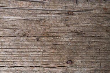 çatlaklar, düğümler ve pürüzlü bir yüzey ile bir tahta şeklinde eski gri-kahverengi doğal ahşap arka plan