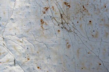 soyut bir arka plan olarak çıkıntılı lifler ve delikler ile beyaz, gri, sarı renk eski kirli yırtık tuval