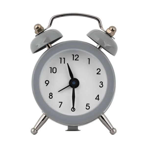 A gray clock with an alarm clock on a white background with arrows showing the time eleven hours thirty minutes or twenty three hours thirty minutes