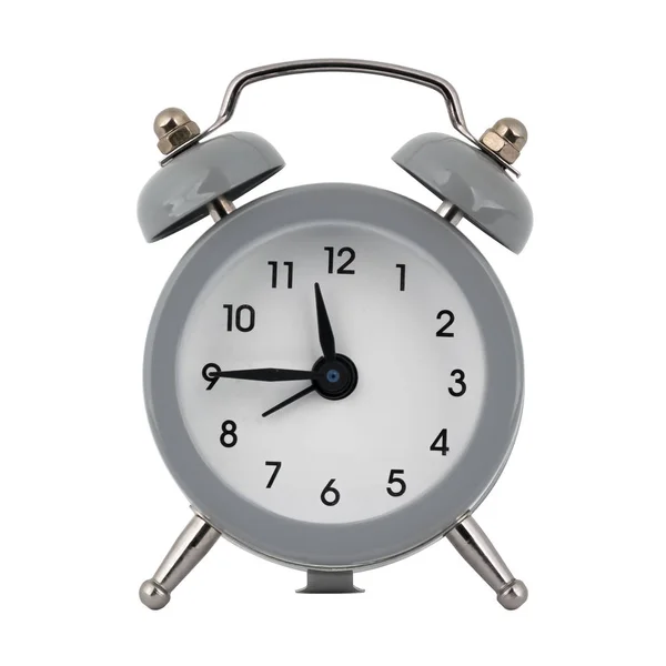 A gray clock with an alarm clock on a white background with arrows showing the time eleven hours forty five minutes or twenty three hours forty five minutes