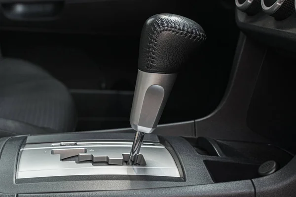 Automotive automatic transmission with black leather lever