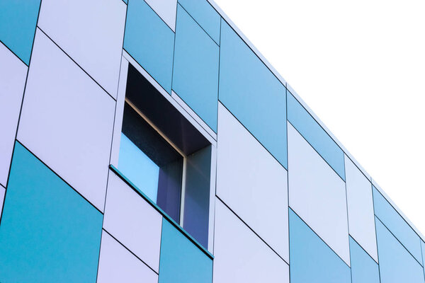 Geometric color elements of the building facade with planes, lines, corners with highlights and reflections for the abstract background and texture of white, turquoise, blue, gray colors. Place for text