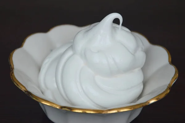 white dessert in a white dish