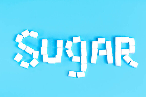 леденец сахар конфеты на синем фоне
