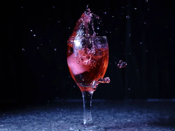 Frozen Moving Image Ice Falling Glass Drink Spills Splashes Stock Picture