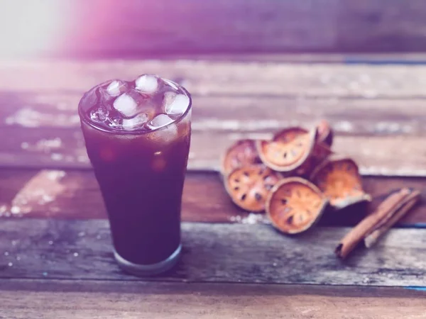 Iced Coffee Glass Blurred Dry Bael Fruit Wood Table Top — Stock Photo, Image