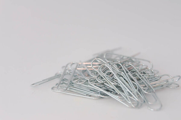 metal clips on white surface close-up