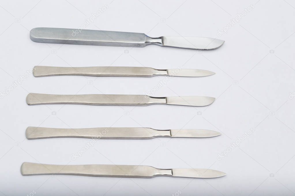 Different One-Piece Scalpels on white background