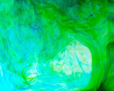 Arka plan ve doku konsepti için gıda renginin damla ve çözünürünün bulanık fotoğrafı.