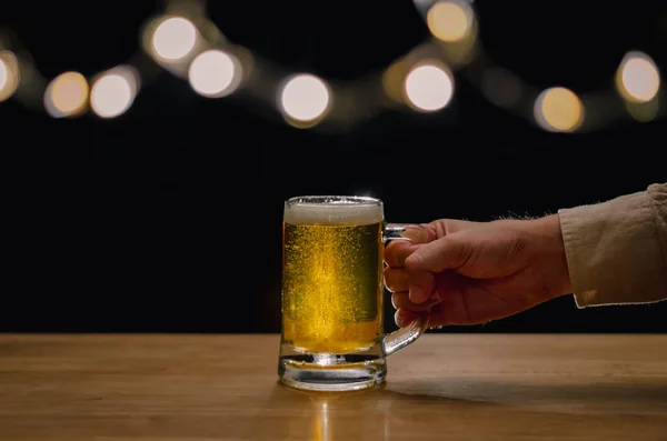 Hand Holding Glass Beer Wooden Table Have Bokeh Lights Top — Stock Photo, Image