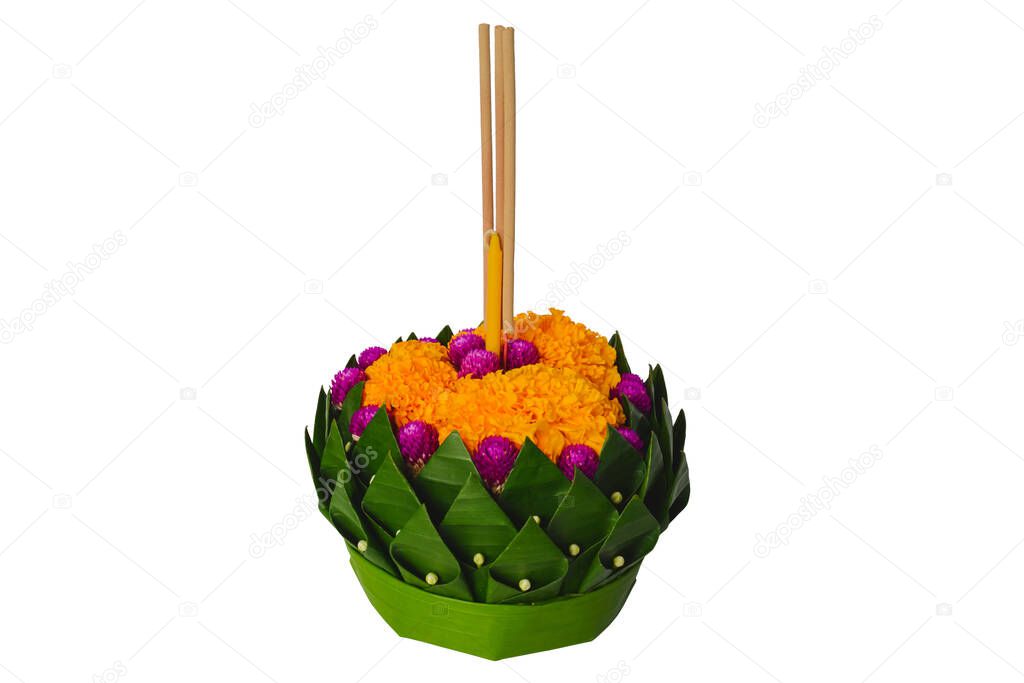 Banana leaf Krathong that have 3 incense sticks and candle decorates with flowers for Thailand full moon or Loy Krathong festival isolated on white background.