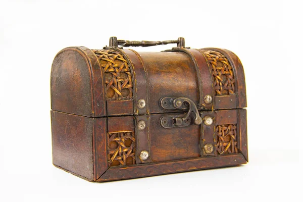 An old chest made of wood and leather with an iron handle and lock Stock Image