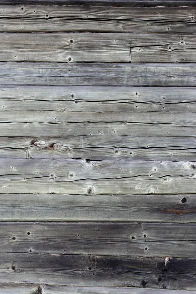 Wooden wall made of gray logs. — Stock Photo, Image