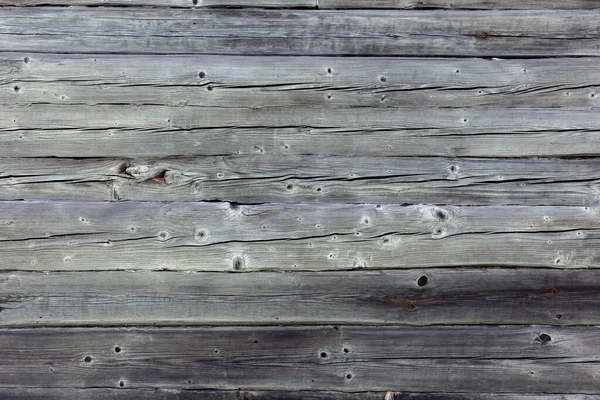 Wooden wall made of gray logs. — Stock Photo, Image