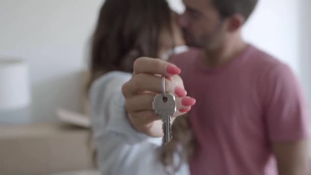 Happy young woman holding keys from new apartment — Stock Video