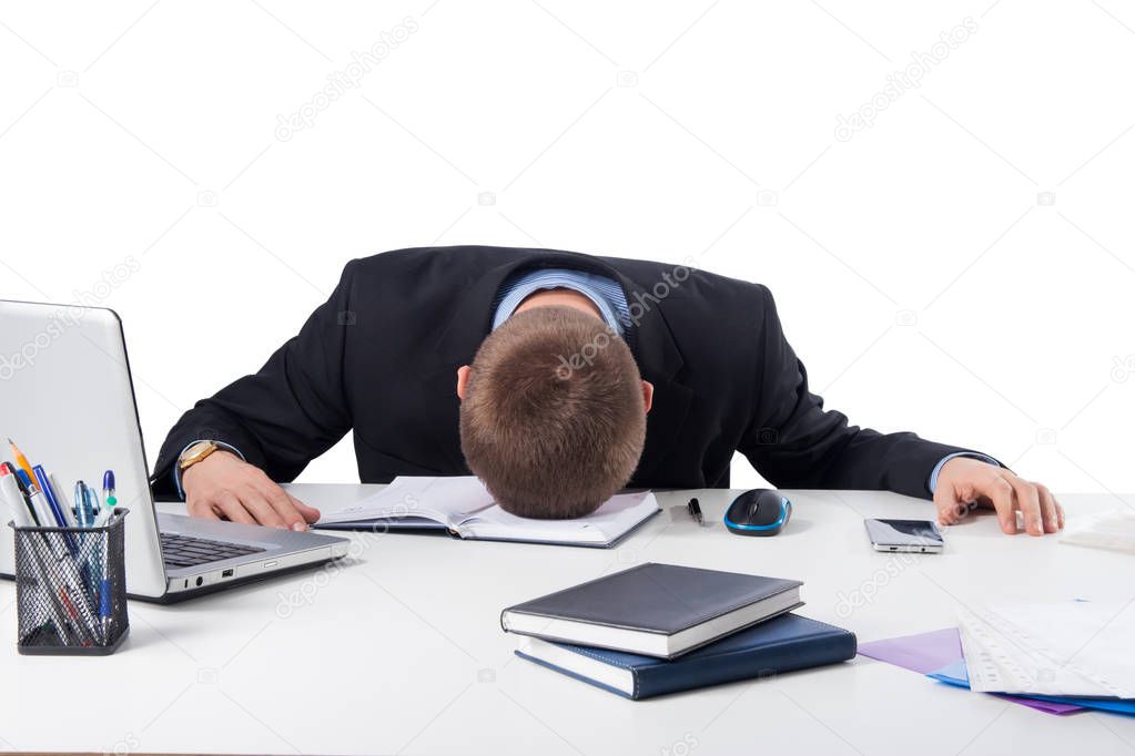 Office,technology, finances, internet, business, success and people concept-Exhausted businessman falling asleep at his office desk isolated on white