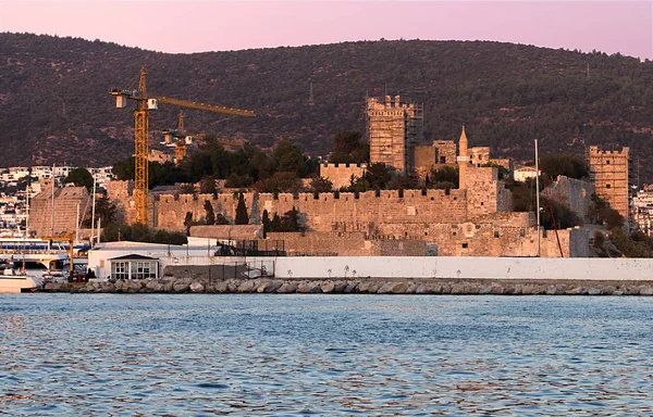 Bodrum Castle restoration in progress, from a distance at evening sun.