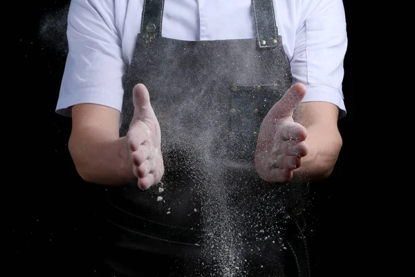 hand clap of chef with flour on black background isolated