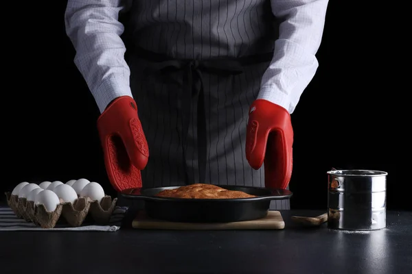 chef make cake. pie making. recipe concept on dark background