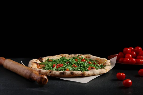 pizza margarita on a dark background. vegetarian pizza concept