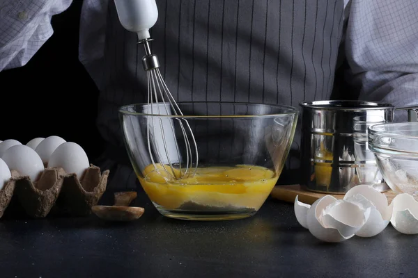 chef make cake. pie making. recipe concept on dark background