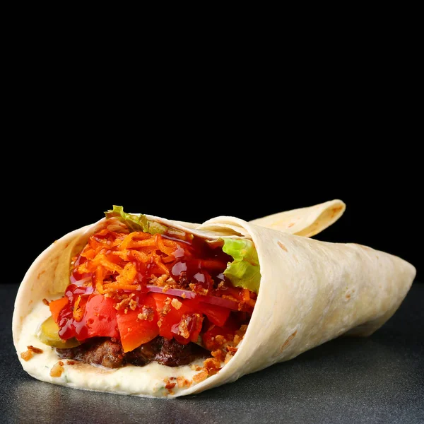 Tasty Burritos wraps with beef and vegetables on black isolated background. Beef burrito, mexican food. traditional mexican food. — Stock Photo, Image