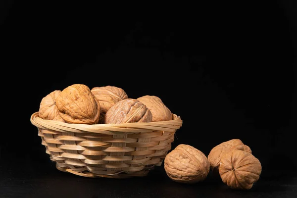 Delicious walnuts on black background — Stock Photo, Image