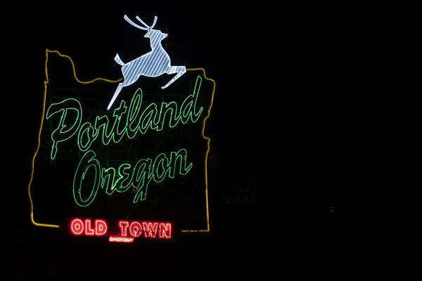 Portland, Oregon white stag sign in downtown at night with copy