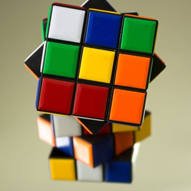 Illusion of another rubik's through mirror clipart