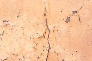 Eski çatlak duvar, çatlaklı turuncu boya.