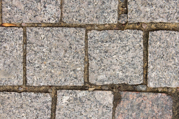 Stone granite tiles close up, city street