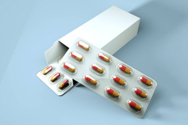 Şeffaf ambalaj içinde küçük yuvarlak renkli kapsüller mavi arka planda haplar bulunan beyaz bir kutunun üzerinde uzanır.