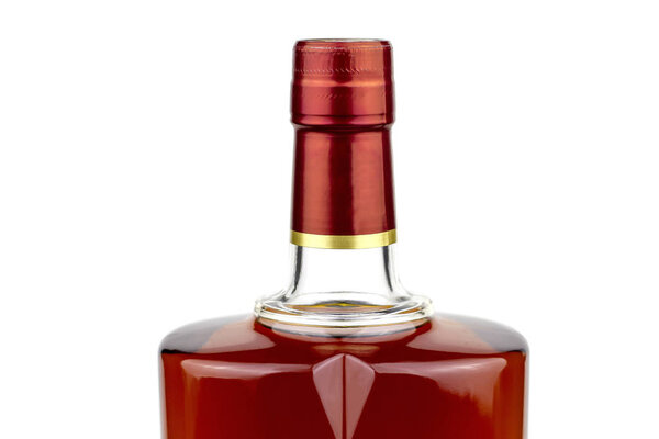 The full bottle of whisky, cognac is isolated on a white background.