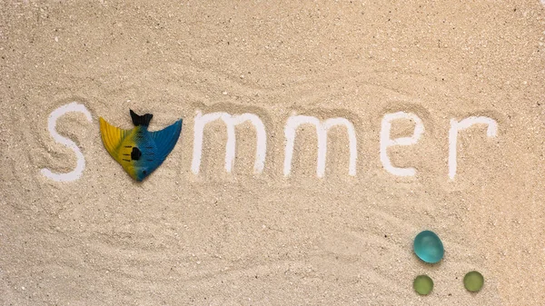 Summer white letters with summer details on sandy background, flatlay, top view