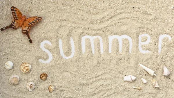 Summer white letters with butterfly and seashells on sandy background. Summer flatlay