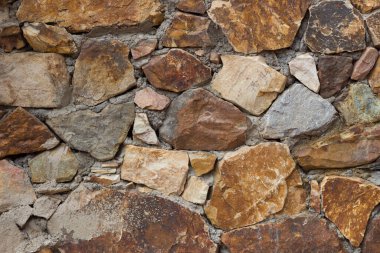 Taş bir duvarın dokusu. Eski kale taşı duvar dokusu arkaplanı.