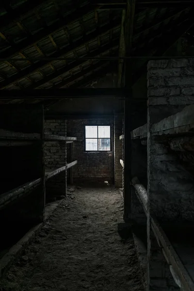 Sleeping quarters with wooden bunk beds showing prisoners terrible living conditions  at The Nazi concentration camp of birkenau in Oswiecim, Poland, a UNESCO World Heritage.
