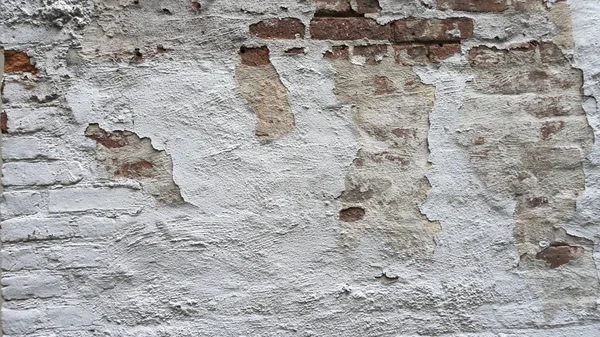 Pared de ladrillo blanco pintado angustiado con pintura astillada —  Fotos de Stock