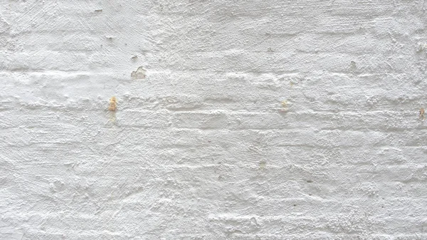 Vernice bianca sul muro interno in mattoni a vista — Foto Stock