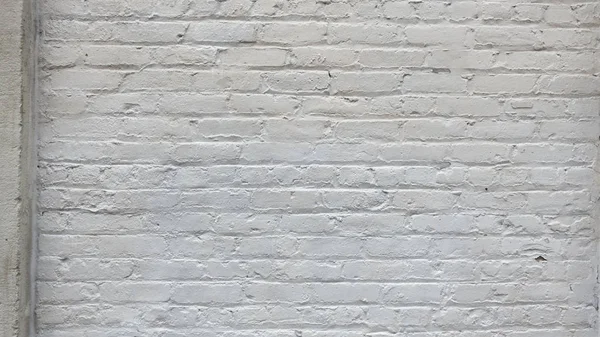 Wit geschilderd over bakstenen muur en baksteen patroon achtergrond — Stockfoto