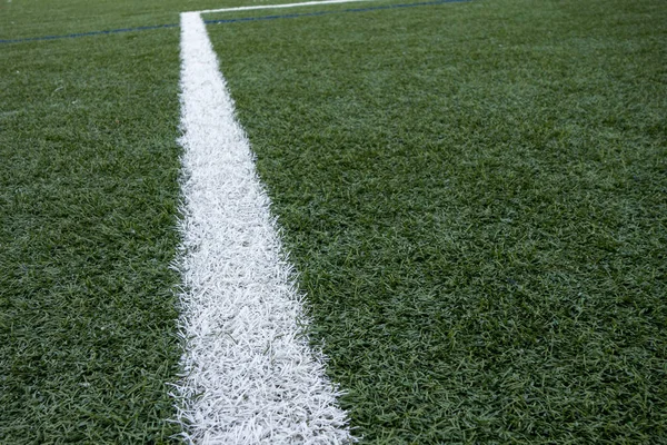 painted white boundary lines of a artficial plastic lawn