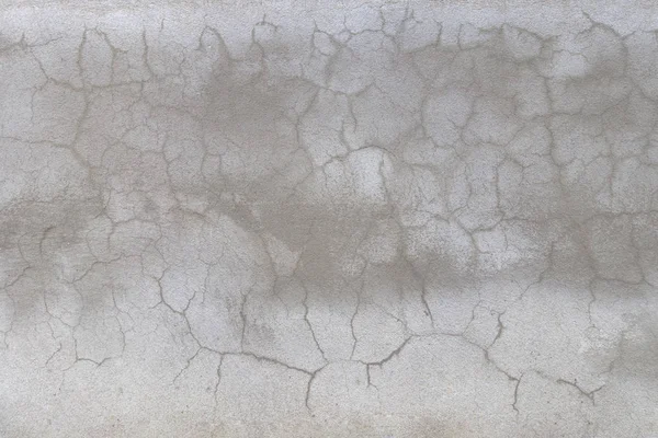 çatlak sıva gri çimento duvar dokulu ve benekli ışıklar ve d