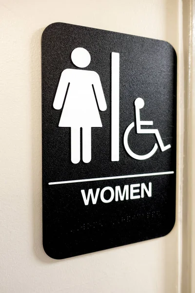 Ladies and wheelchair access bathroom sign and icons — Stock Photo, Image