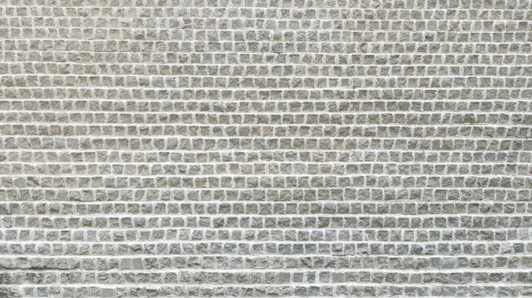 Weißes Kopfsteinpflaster legte sich wie Ziegel strukturierten Hintergrund — Stockfoto