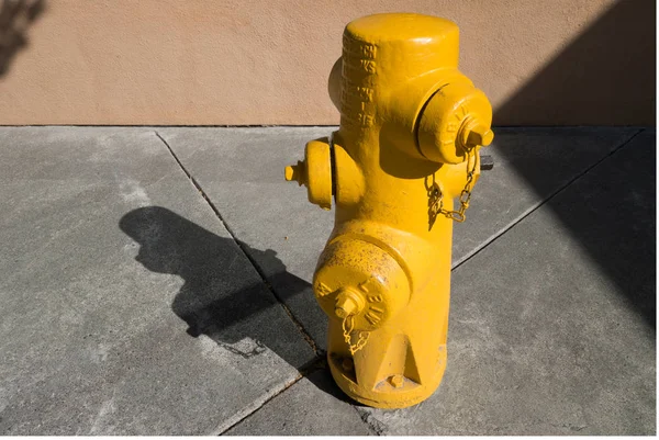 Yellow city fire hydrant, water pressure