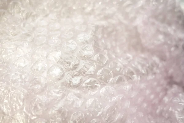 泡沫包装塑料与浅粉色透明色调 — 图库照片
