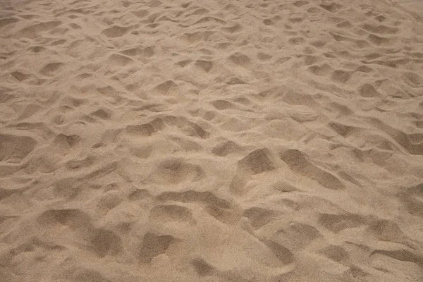 Fechamento de padrão de areia de uma praia no verão — Fotografia de Stock