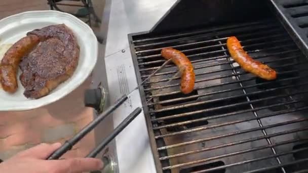 Lifestyle Summer Outdoor Man Cooking Stakes Sausages Propane Gas Grill — Stock Video