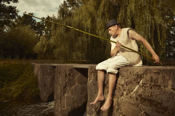 Man Bowler Hat Fishing Rod Trying Catch Fish — Stock Photo, Image